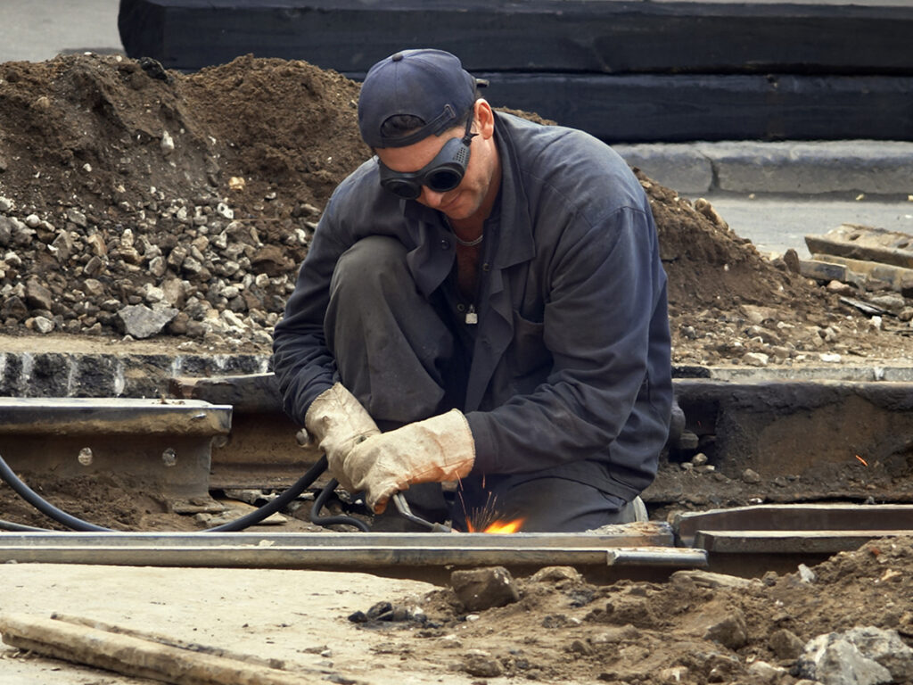 Welder wearing safety glasses