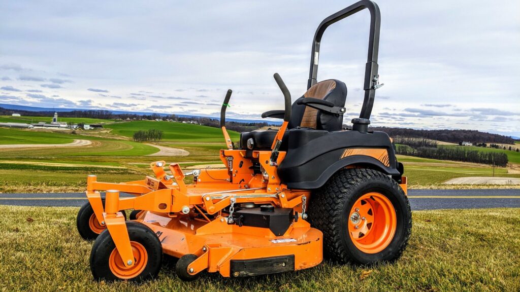 A large orange zero turn lawn mower