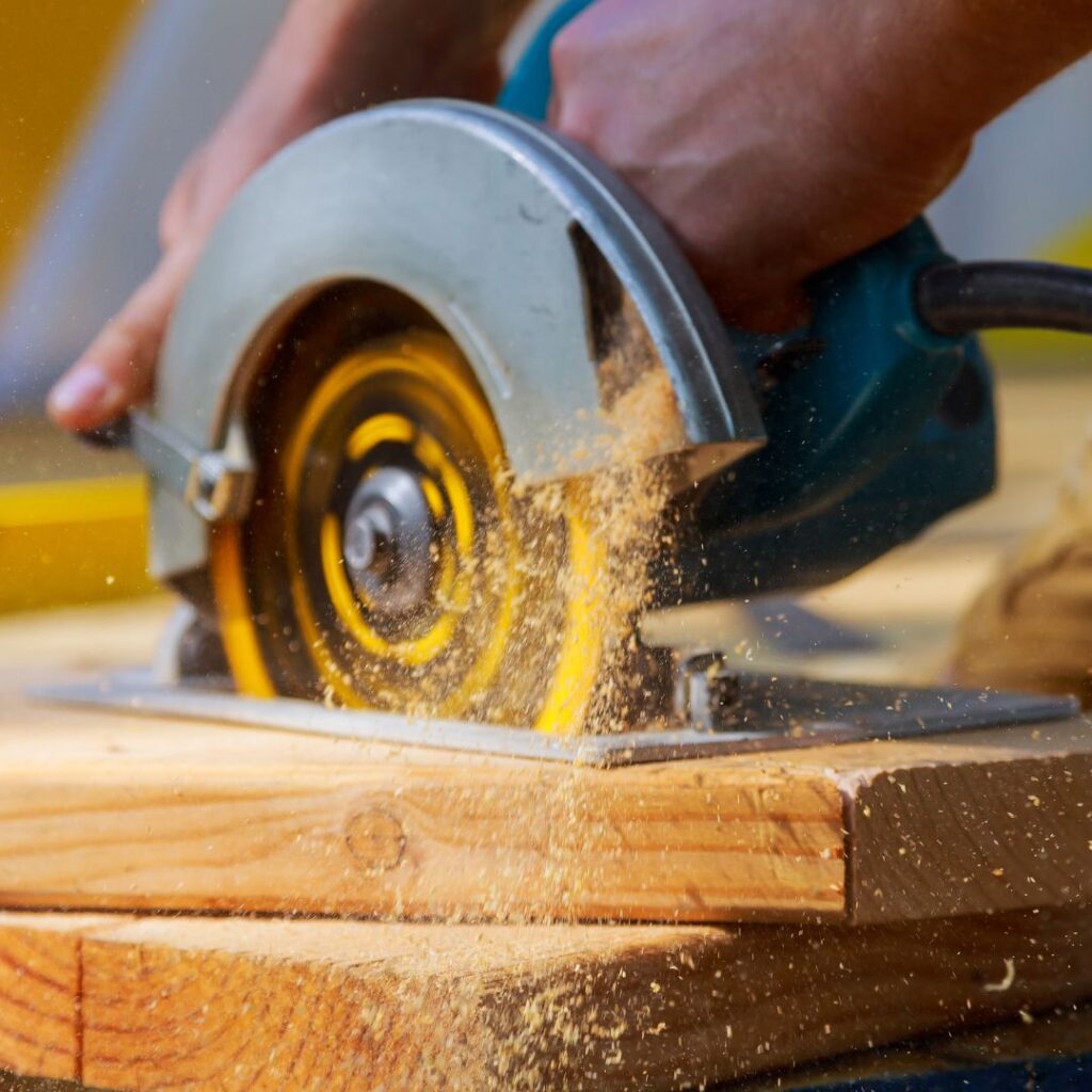 using a power saw on wood