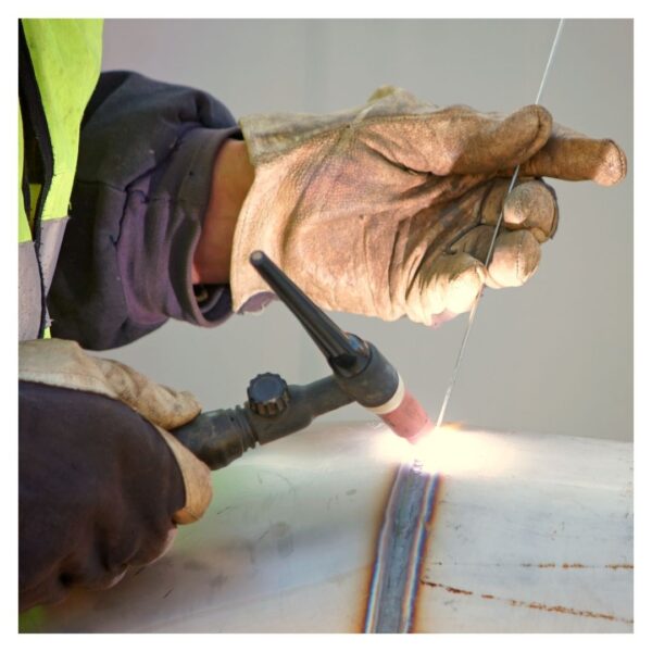 Welder wearing welding gloves