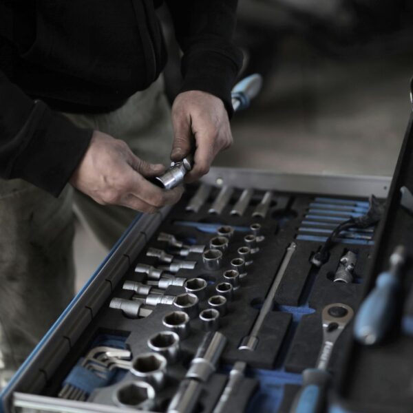 person puts socket on ratchet