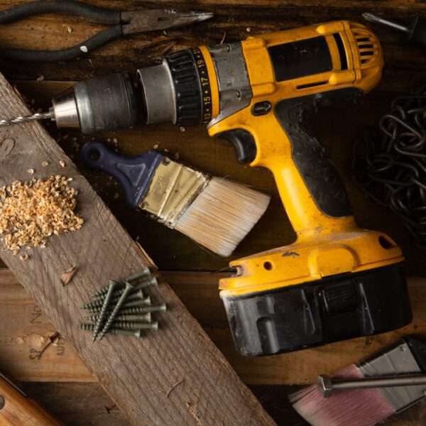 A high-quality stock photo of a powerful cordless drill with a black and yellow finish
