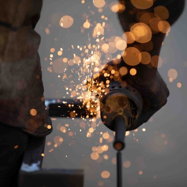 person safely working on a welding project